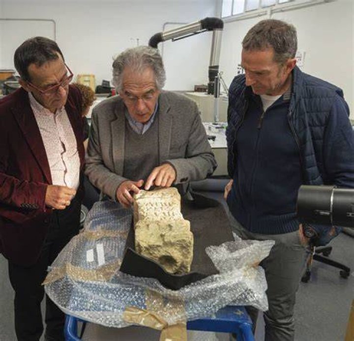 Researchers Examining The Votive Altar